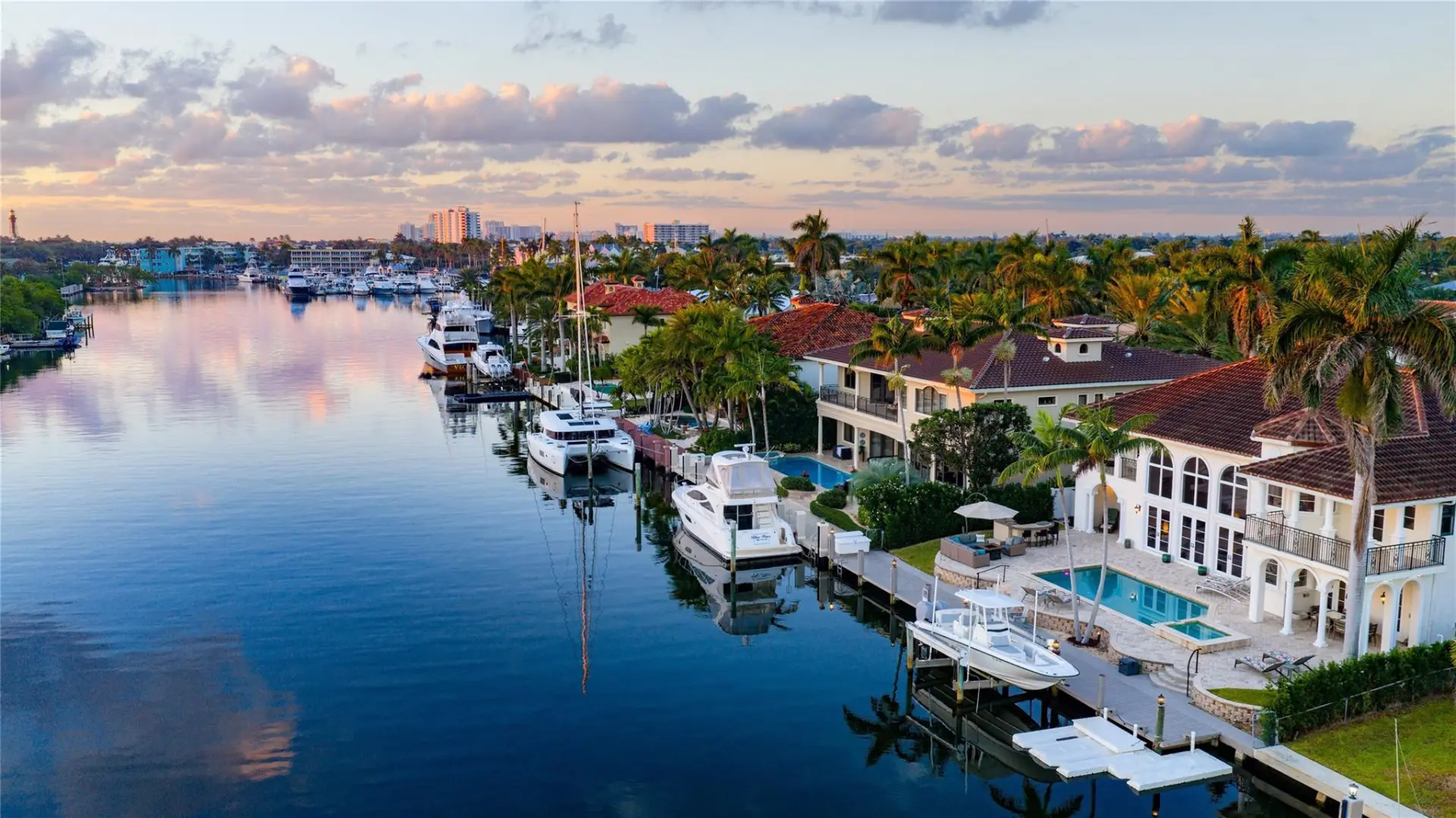 Lighthouse Point, Florida homes for sale — Aerial view of Lighthouse Point Florida waterfront homes on deep-water canals with private docks and yachts